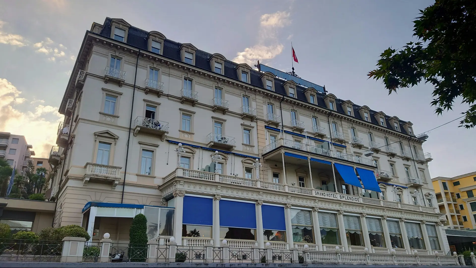The facade of a grand hotel with rows of shuttered windows